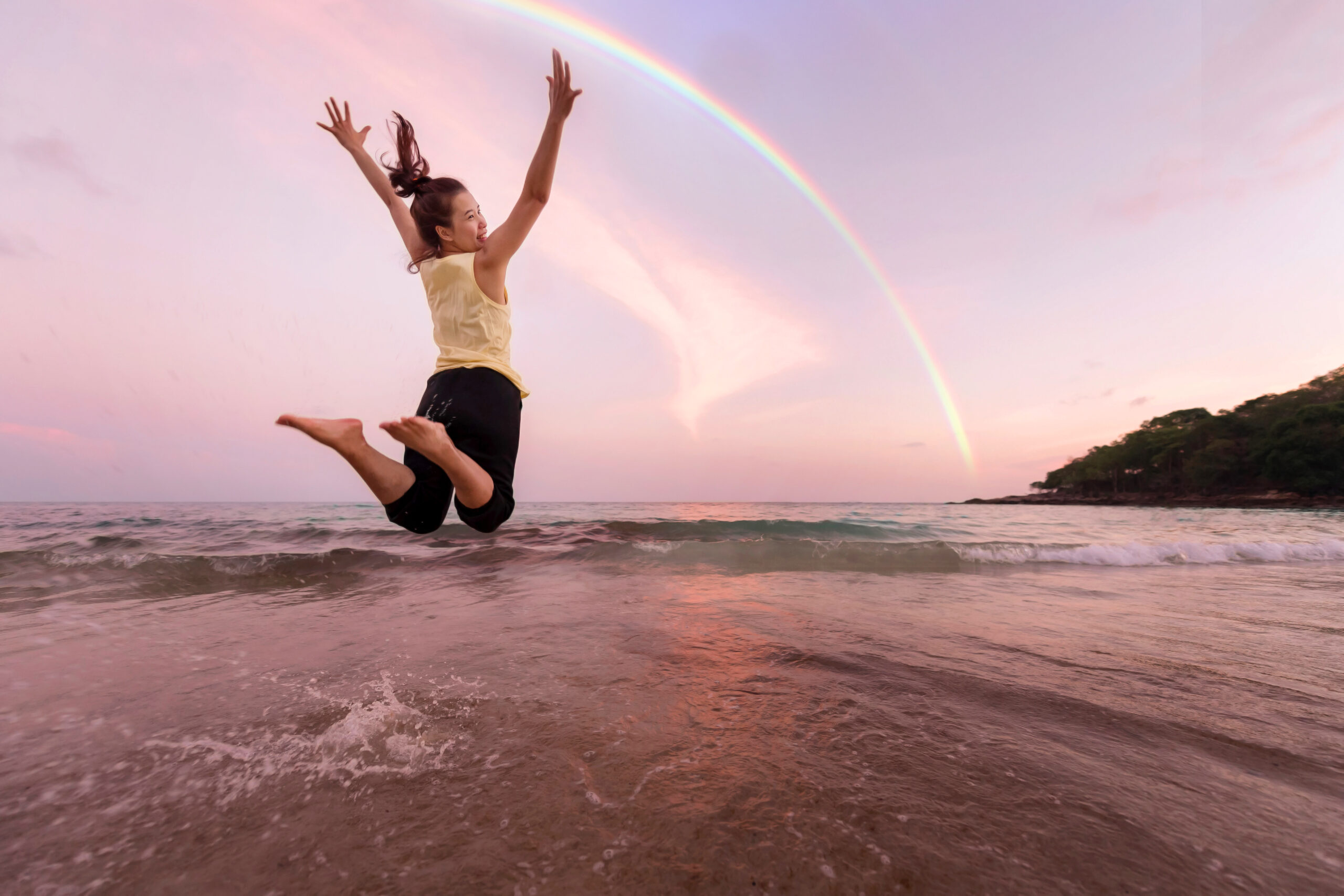 Woman is jumping and relax on beach. Positive emotions. Summer concept.